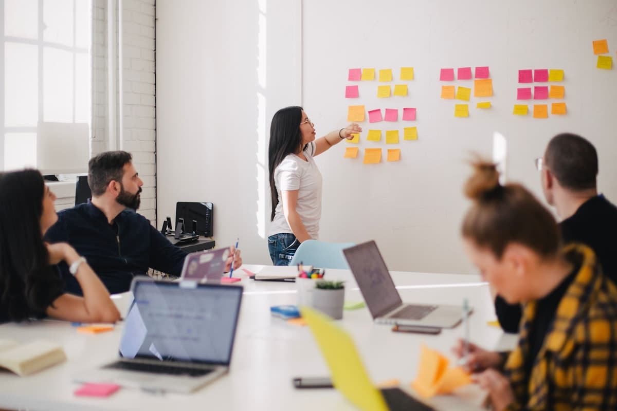 Diverse team collaborating on strategy in a modern meeting room